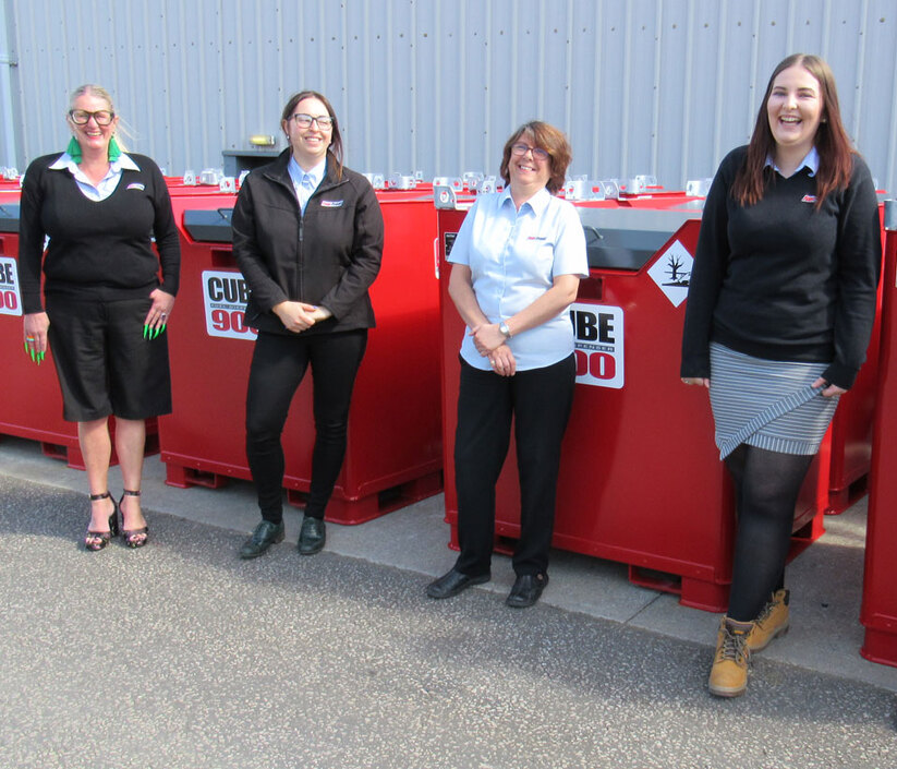 The friendly, professional Fuel Proof Sales team smiling beside our Fuelcube diesel tanks